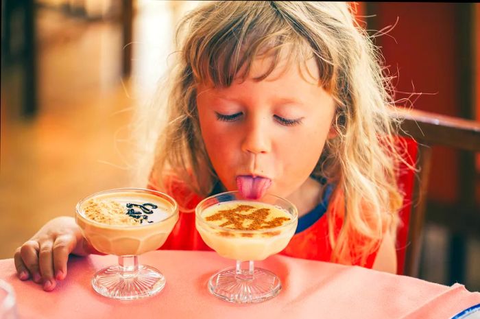 A child enjoying homemade chocolate mousse in Portugal