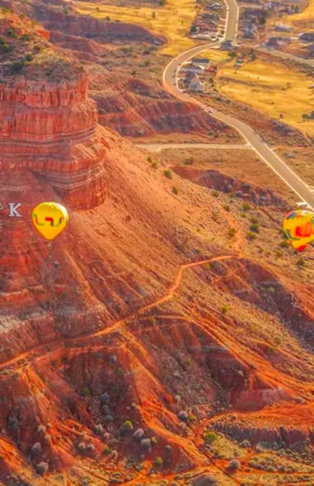 Colorful hot air balloons soaring above K Mountain in Kanab, Utah