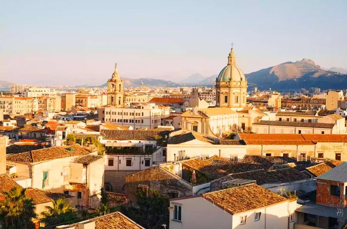 Palermo, aerial view over city rooftops at sunset