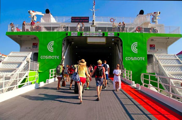 Tourists boarding a ferry to Santorini island at the Heraklion port.