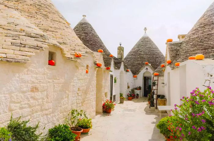 Trulli houses adorned with pumpkins in Alberobello, Puglia