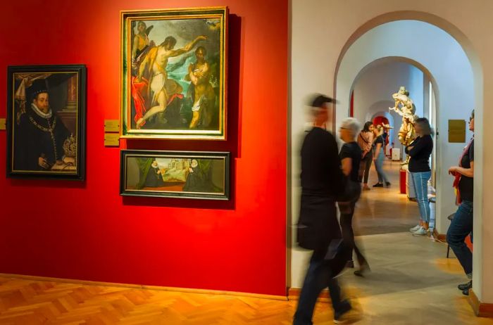 Visitors stroll past Flemish artworks in the National Museum of Wroclaw.