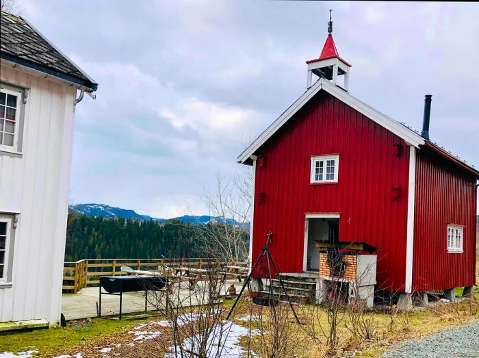 A vibrant red storehouse at Skølberg Søndre farm, Trøndelag, Norway