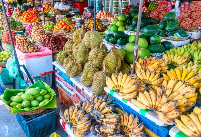 A vibrant fruit stand showcasing a colorful array of fresh fruits.