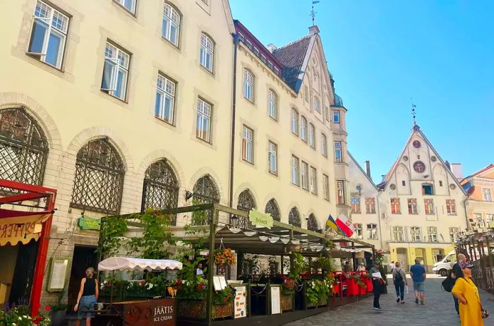 A square featuring cafes and a market in Old Town