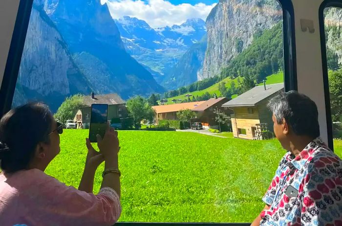 Older parents gazing out a picturesque train window