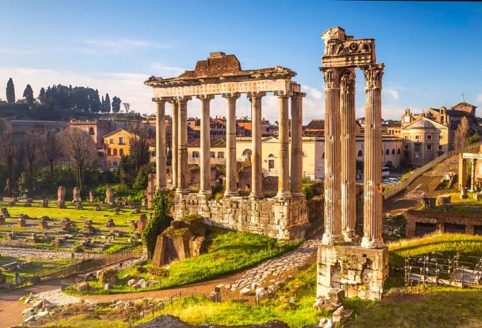 The Roman Forum showcases the remnants of significant ancient buildings, enveloped by a dense cluster of compact structures.