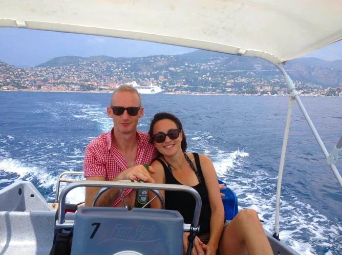 A couple enjoys sailing a license-free yacht off the coast of Cannes, creating an attainable luxury holiday experience © Chrissie McClatchie