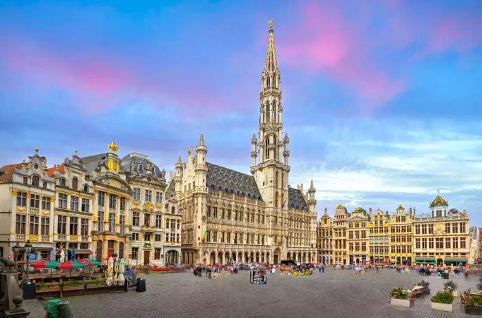 A sweeping view of Grand Place (Grote Markt) featuring the gothic City Hall in Brussels, Belgium