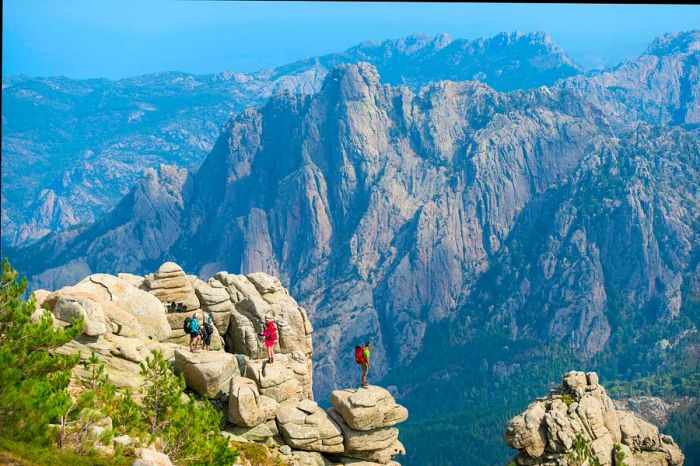 Trekking along the GR20 trail in Corsica, near the Aiguilles de Bavella, on the way to Refuge d'Asinao