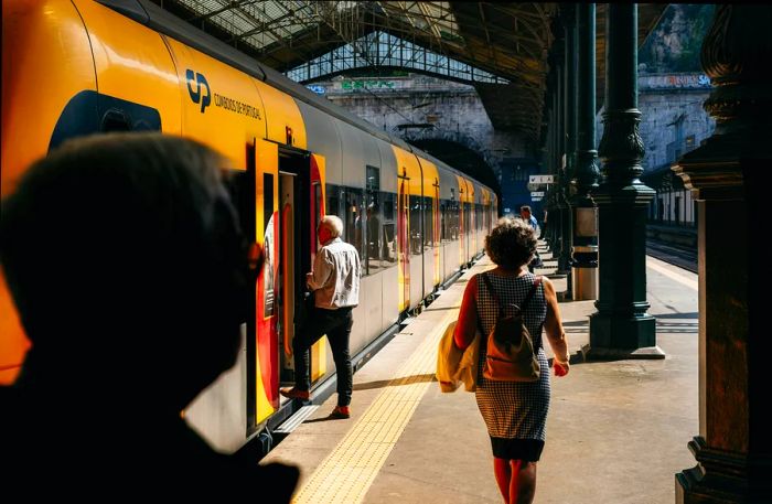 Passengers boarding a train on a summer day in Portugal