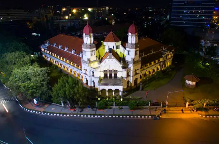 Aerial view of the Lawang Sewu facade illuminated at night