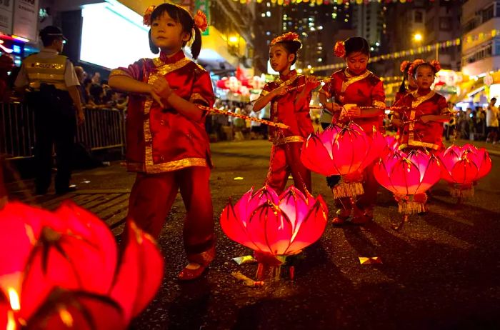 Tai Hang residents perform the Fire Dragon Dance to celebrate the Mid-Autumn Festival on September 8, 2014, in Hong Kong, China.