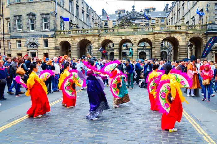 Women performing on the streets during the Edinburgh Fringe Festival in Scotland.