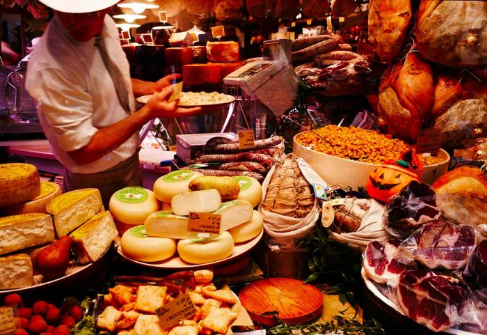 A vibrant shop window filled with delicious food in Bologna, Italy