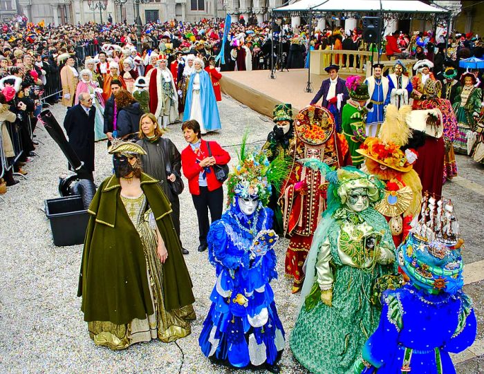 Vibrant participants in costumes and masks during the Carnival in Venice.