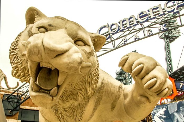 A low-angle shot of the white tiger sculpture outside Comerica Park in Detroit