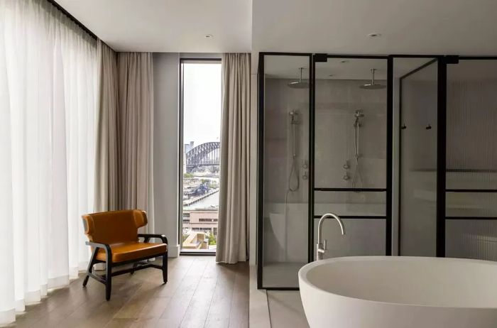 Spacious bathroom with a view in the Liberty Suite at Capella Sydney, a luxury hotel in Australia