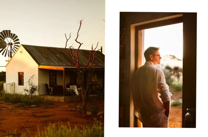 The exterior of a restaurant set in the desert; a man stands at the entrance of the restaurant.