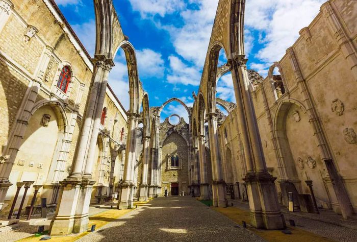 The ruins of the Carmo Convent in Lisbon, open to the sky above.