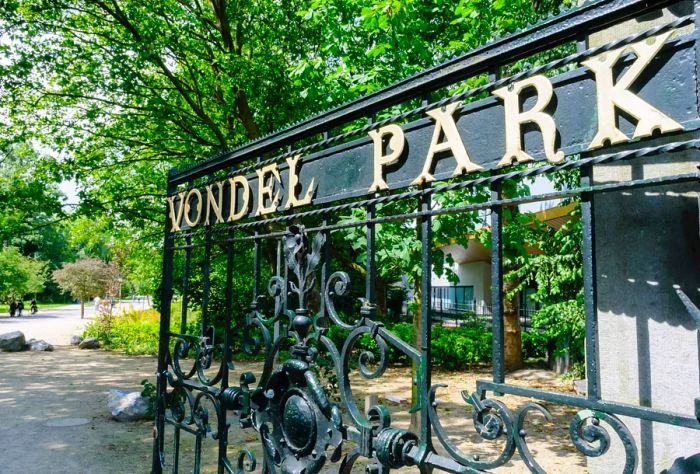 A decorative wrought iron gate with the words VONDEL PARK inscribed on it.