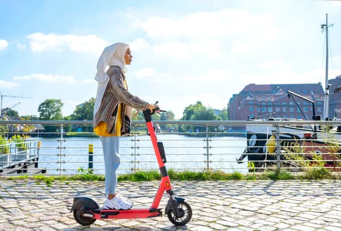 DEST_GERMANY_BERLIN_THEME_PEPLE_SCOOTER_GettyImages-1338882439