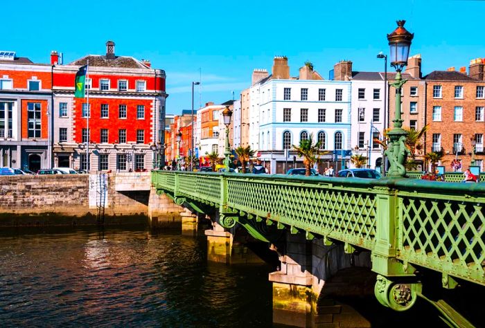 A road bridge set against vibrant buildings at an intersection.