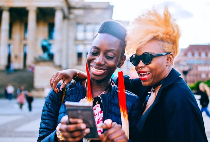 DEST_GERMANY_BERLIN_THEME_PEOPLE_LGBTQ_COUPLE_DIVERSE_DEVICE_GettyImages-957556544