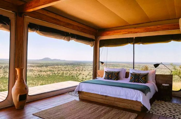 A beautifully arranged bed with a view at Habitas Namibia