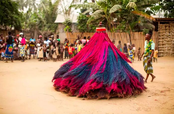 Villagers participate in the Zangbeto Voodoo ritual in Grand Popo, Benin, Africa.