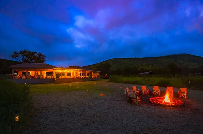 Lounge and Dining Area at Dunia Featuring Campfire Setup