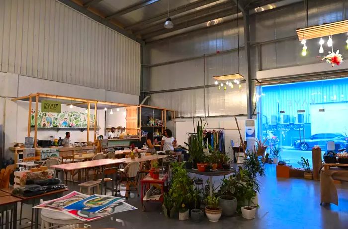 Visitors enjoy The KAVE cafe at Alserkal Avenue in Dubai, on December 28, 2019. Alserkal Avenue is an industrial area that became a vibrant hub for art galleries, start-ups, and unique retail spaces in 2008.