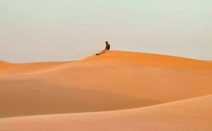 Standing on a dune in the Wahiba Sands, a desert expanse in eastern Oman.