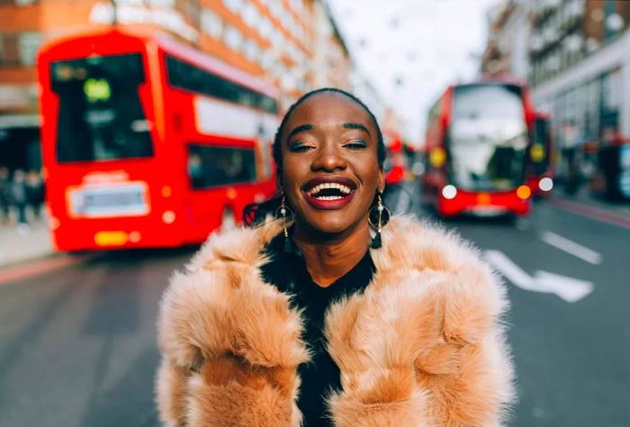 DEST_UK_ENGLAND_LONDON_PEOPLE_WOMAN_LAUGHING_OXFORD_STREET_BUS_GettyImages-1054835750 copy