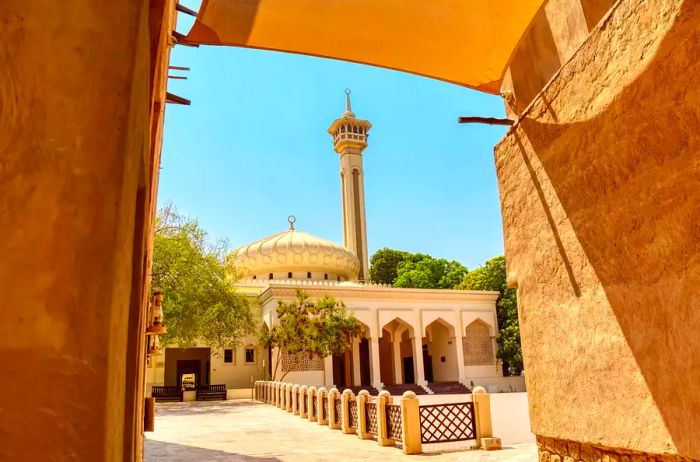 Old Dubai. Traditional Arabic streets in the historic Al Fahidi district, featuring Al Bastakiya Mosque. Dubai, United Arab Emirates