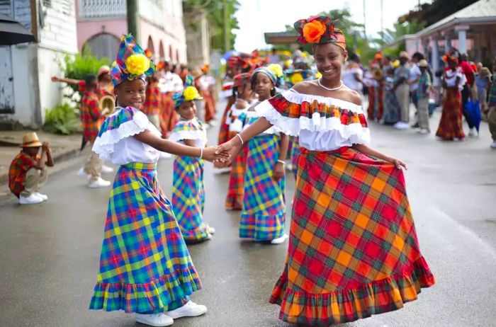 Two young girls participating in the St. Croix Christmas Festival parade