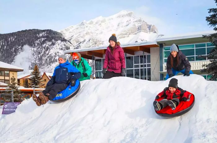 A group of individuals tubing at the SnowDays festival.