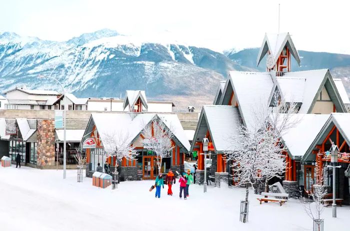 Jasper, Canada, during winter, showcases a snow-covered landscape alongside charming village architecture