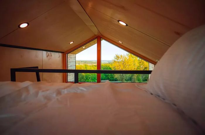 The bed within the Meridian63° luxury camping micro cabins on Prince Edward Island