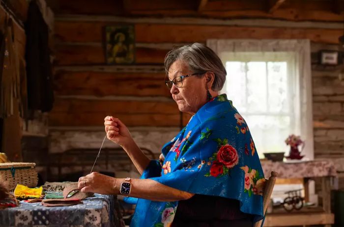 Lilyrose Meyers is seen working on embroidery at Métis Crossing.