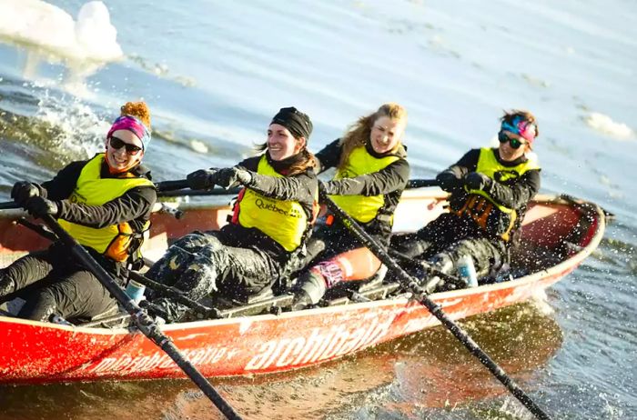 A team of four navigates the icy waters during Québec's Carnival.