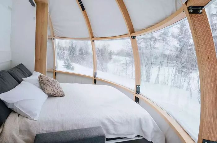 Interior view of a bed inside a dome at Station Boréale in Canada