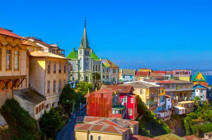 A view of the vibrant buildings and Lutheran church on Cerro Concepcion in Valparaíso, Chile, a UNESCO World Heritage City.