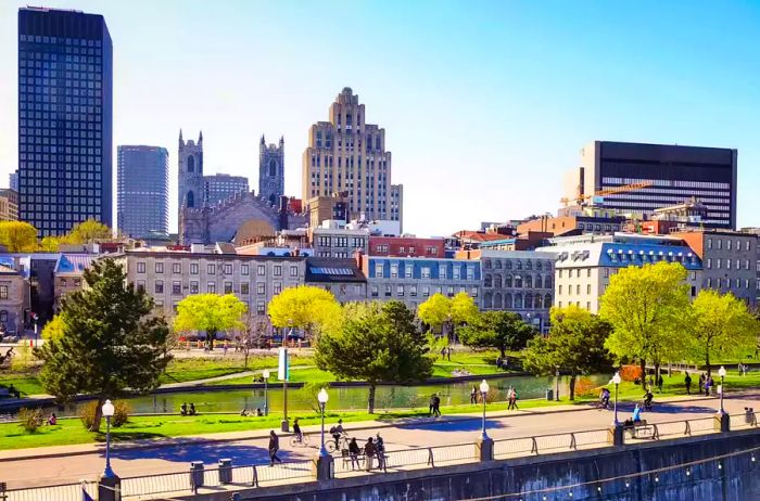 The Old Port of Montreal and the downtown skyline viewed from the promenade pier on a clear spring day in May.