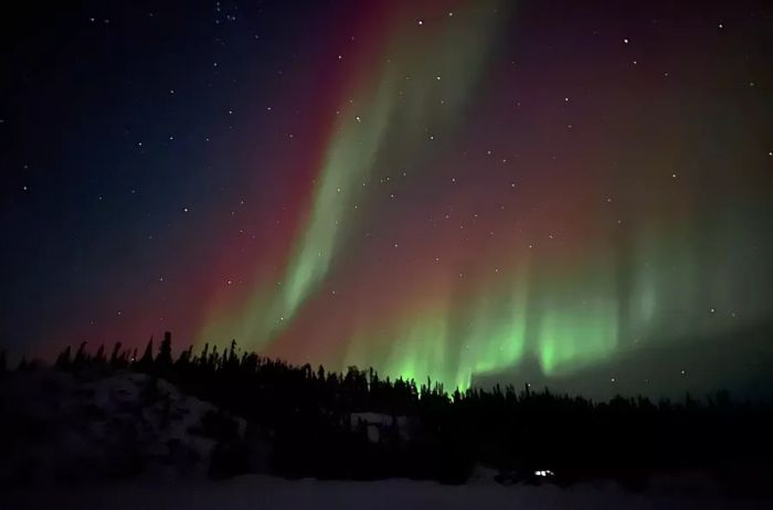 A vibrant display of northern lights dancing in the night sky