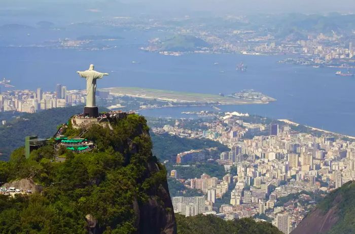 Aerial view of the iconic Christ the Redeemer statue overlooking the city of Rio de Janeiro.