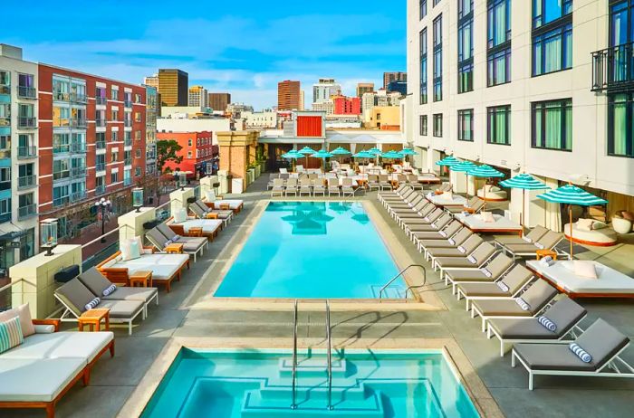 Pool area at the Pendry San Diego hotel, featuring stunning city views