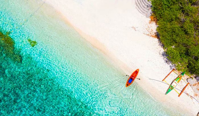 Aerial view of the white sand beach and shoreline at Sumilon Island, Oslob, Cebu, Philippines