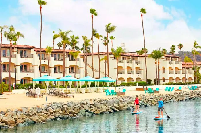 Paddleboarders in front of Kona Kai San Diego hotel