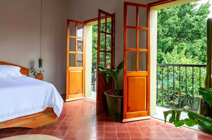 A hotel room that opens directly onto a patio.